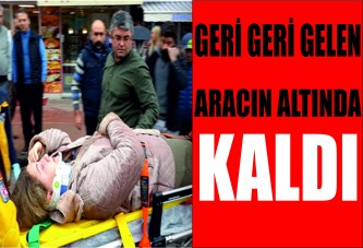 Geri geri gelen aracın altında kaldı