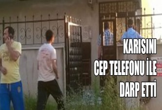 Karısını cep telefonuyla...