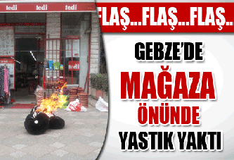 Mağaza önünde yastık yaktı