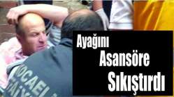 Ayağını asansöre sıkıştırdı